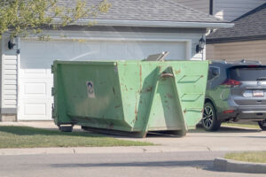 Construction rental dirt bin, dumpster outside single family home
